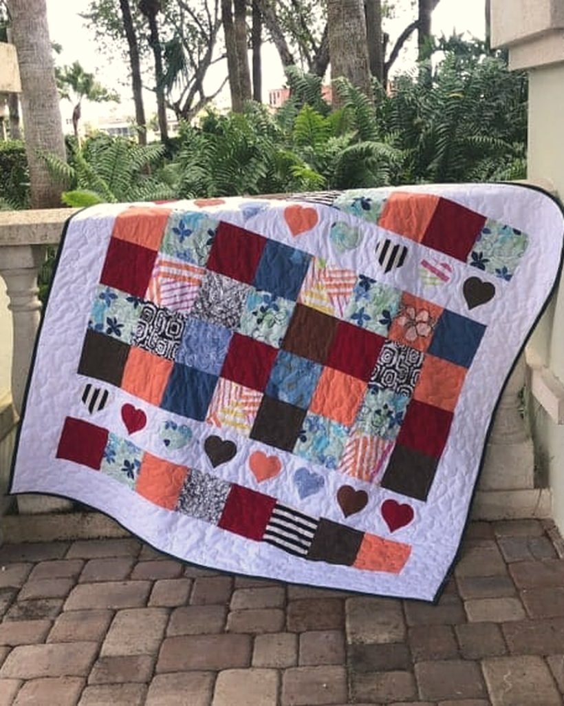 A finished memory quilt made from repurposed garments